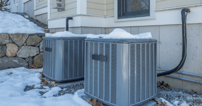 heating and ac unit sitting in the snow